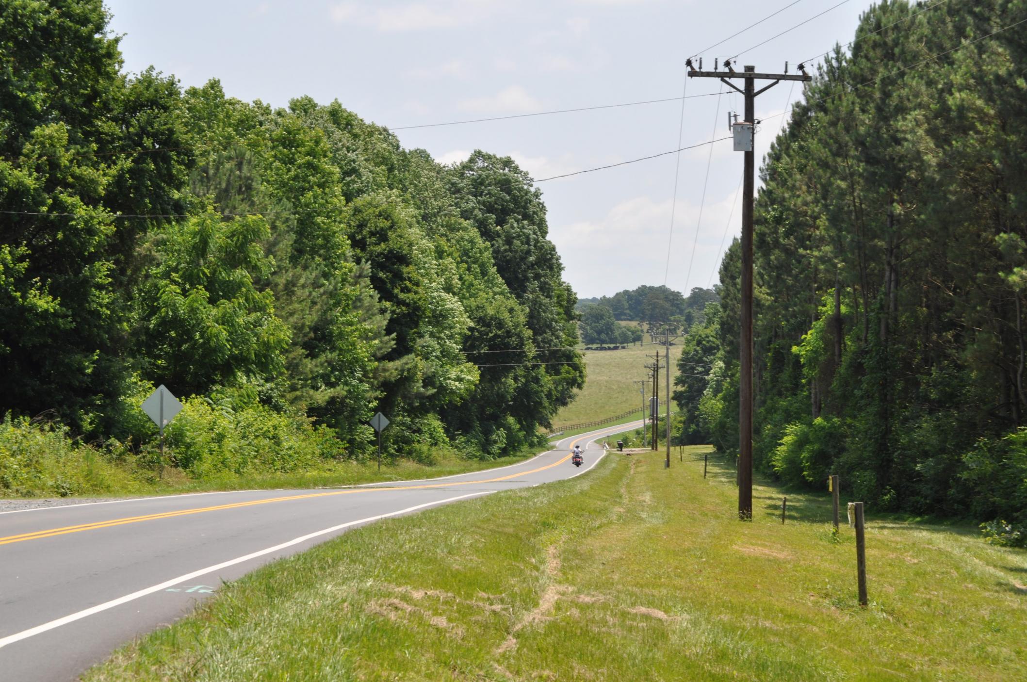 overhead power lines by the roadside