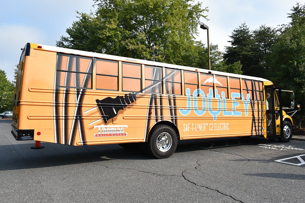 image of electric school bus with "jouley" logo on it